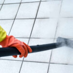 Woman using steam cleaner