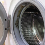 Mould on the seal washing machine in the bathroom.