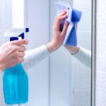 Cleaning,And,Polish,Mirror,With,Rag,And,Spray,In,Bathroom